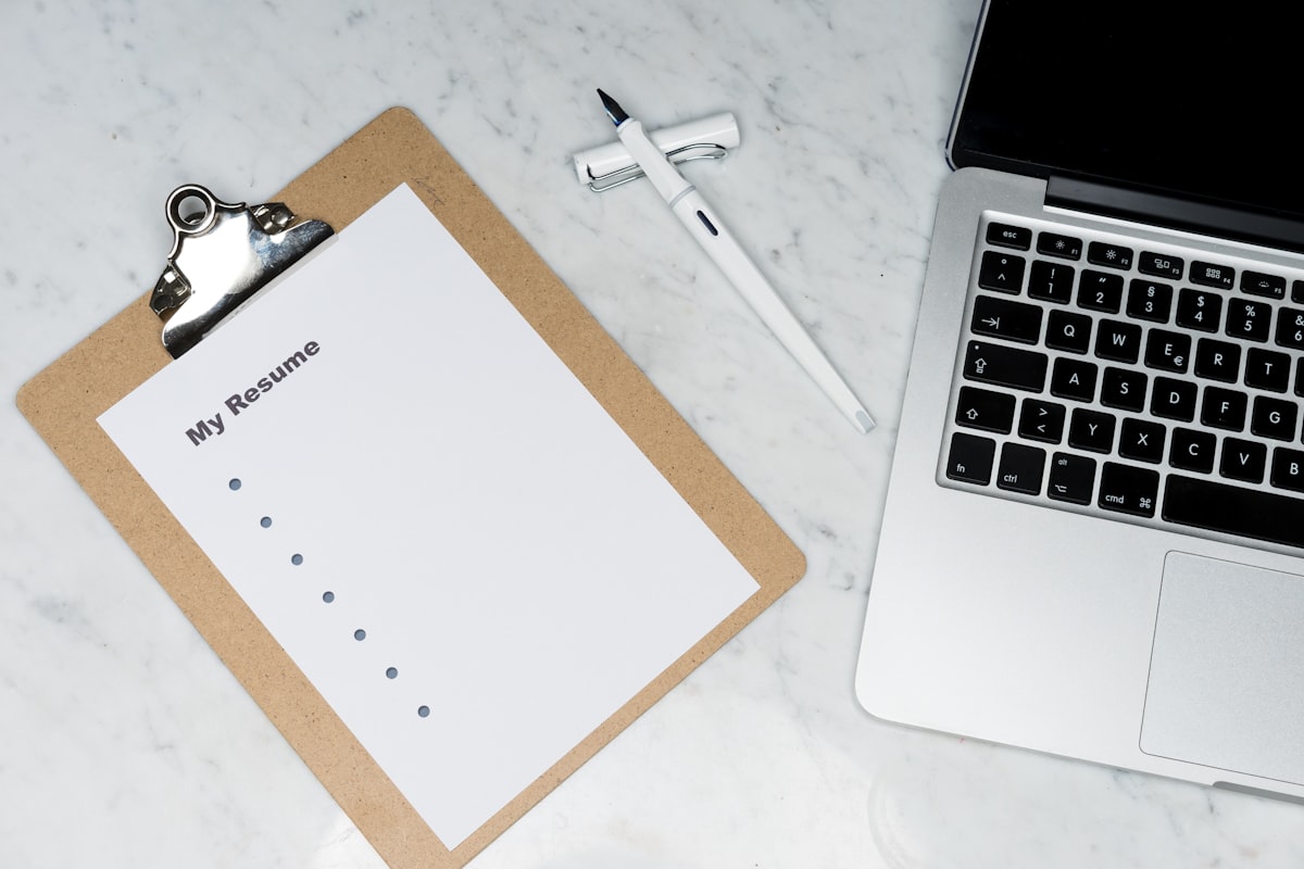 Professional writing a resume for Singapore job market 2026